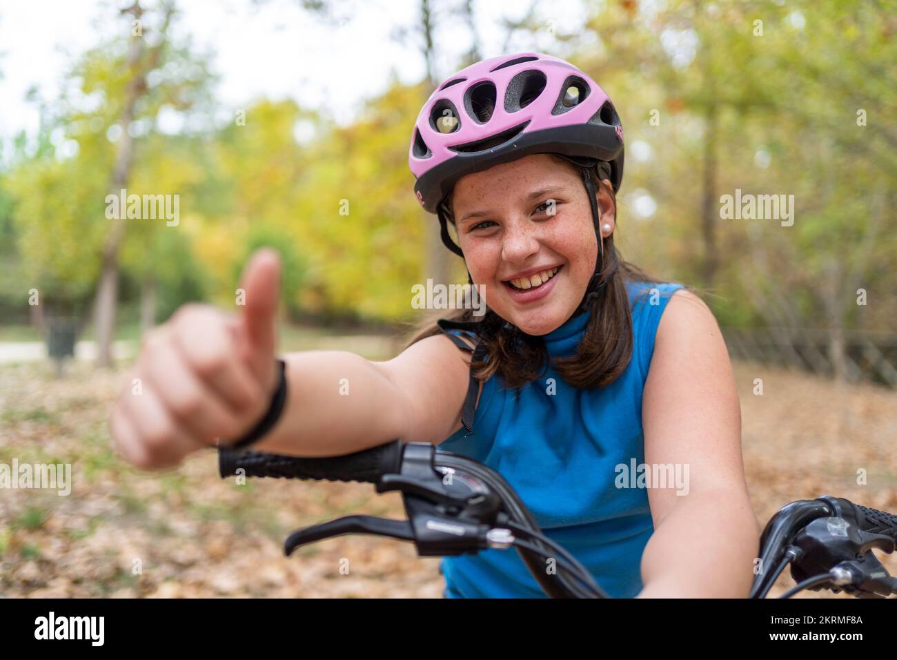 Happy girl show thumb hi-res stock photography and images - Alamy