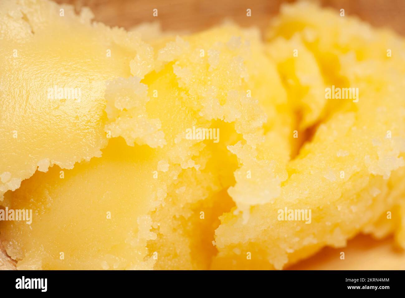 Homemade melted ghee clarified butter close up macro food background