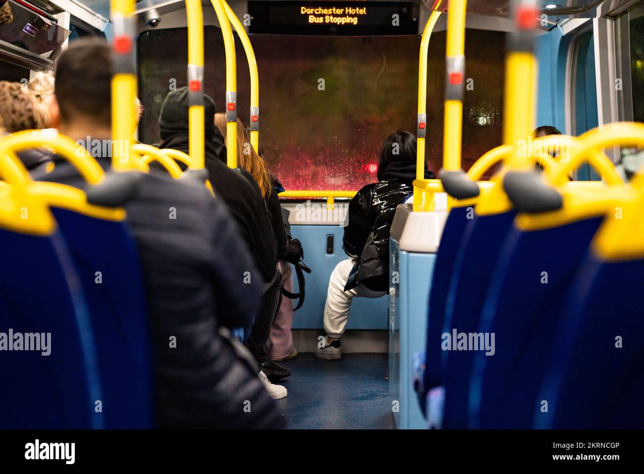 Double decker bus interior with passengers. Stock Photo