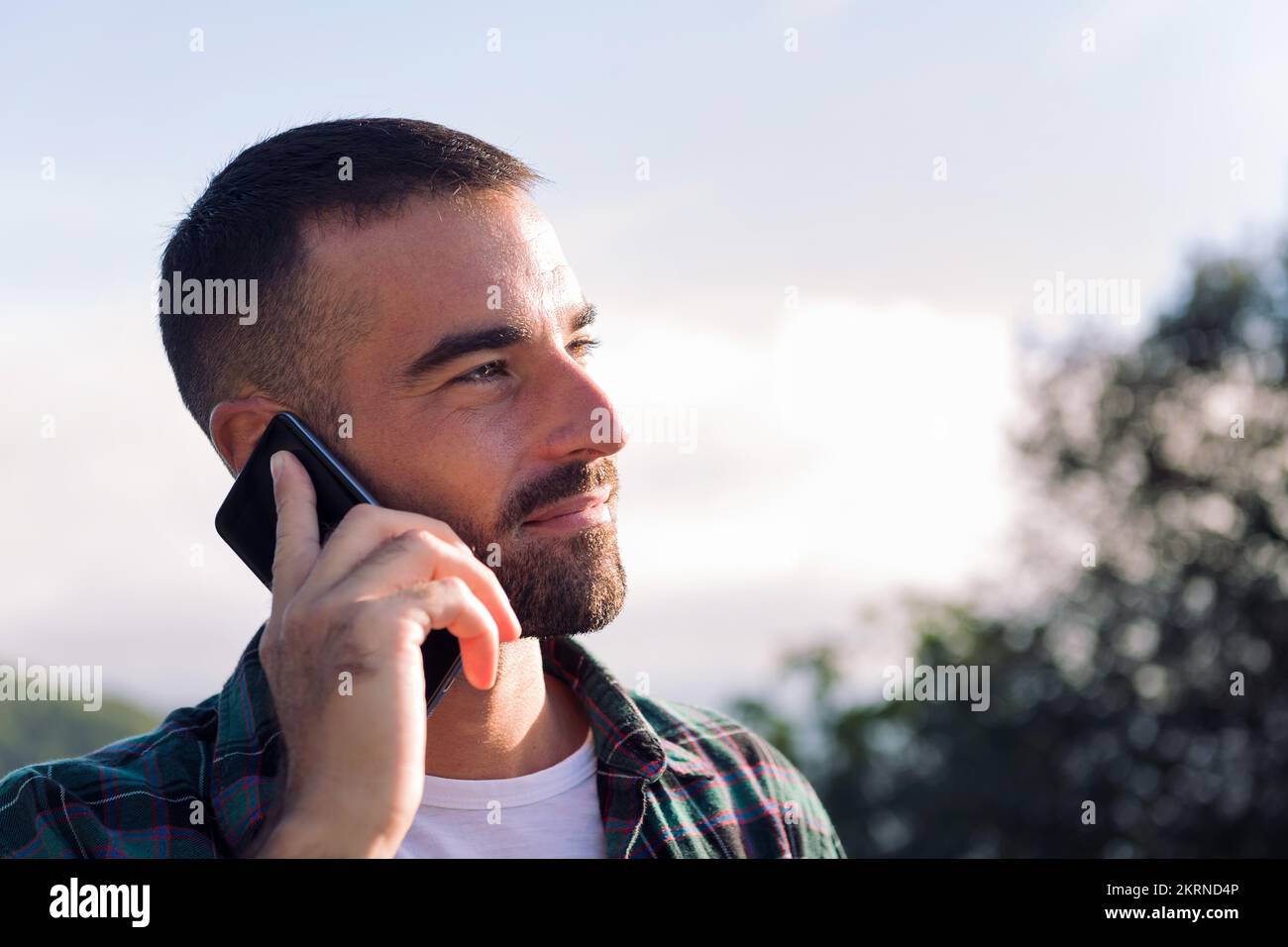young man talking on mobile phone Stock Photo