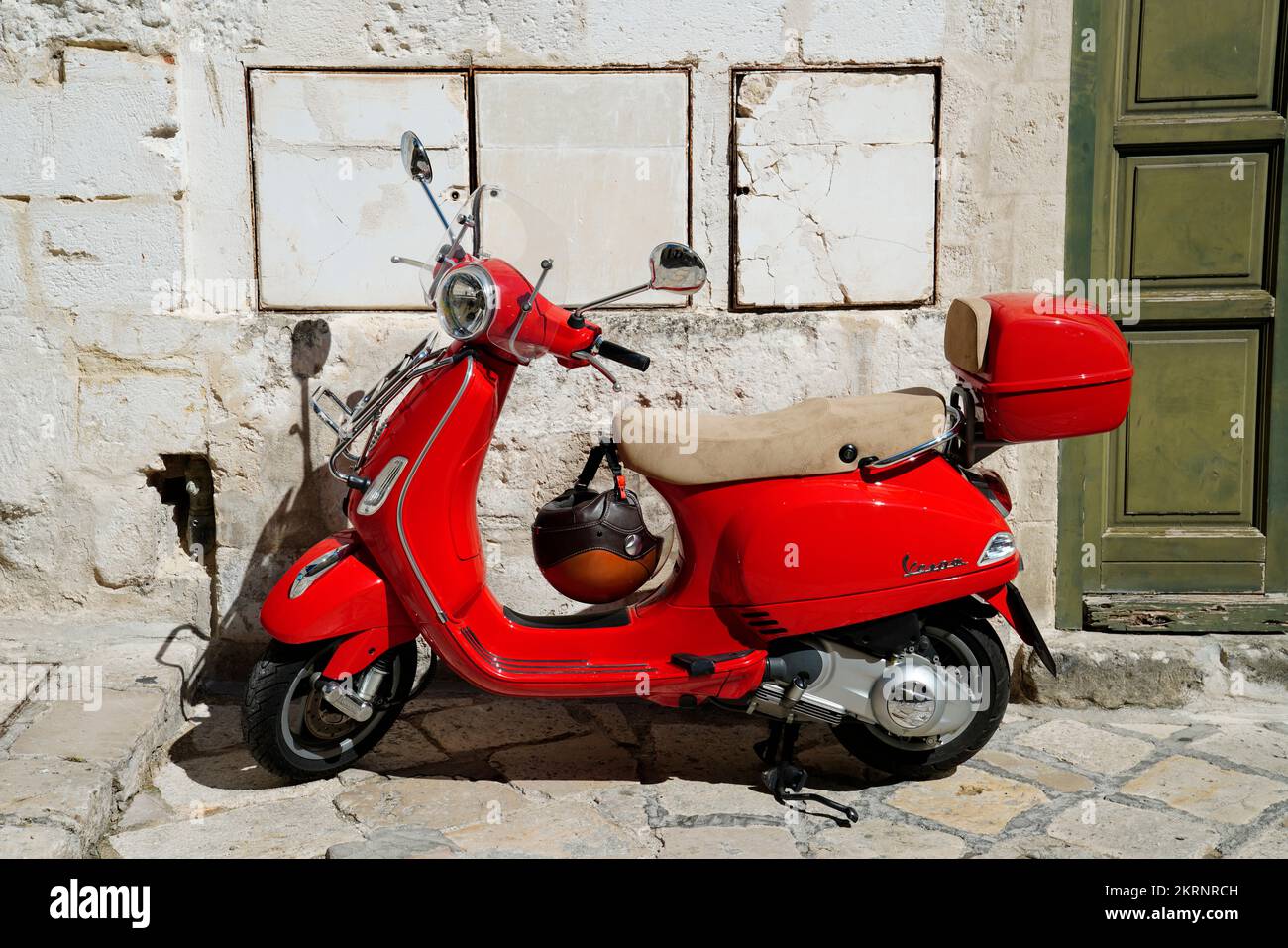 red Vespa scooter,Italy,Europecity Stock Photo
