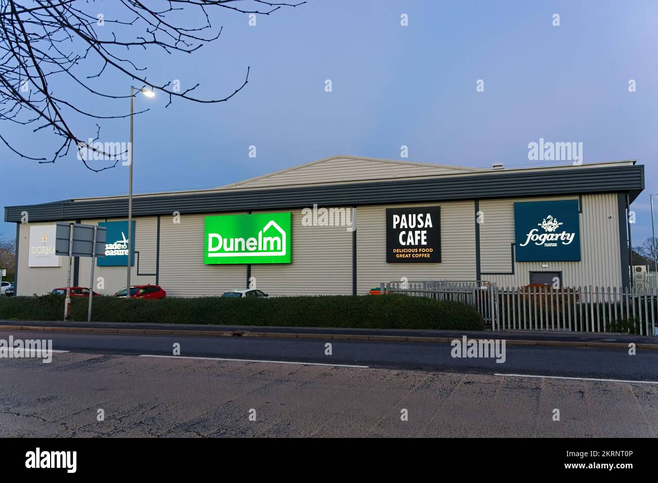 Dunelm superstore with an illuminated sign at the shopping park on the edge of town at sundown Stock Photo