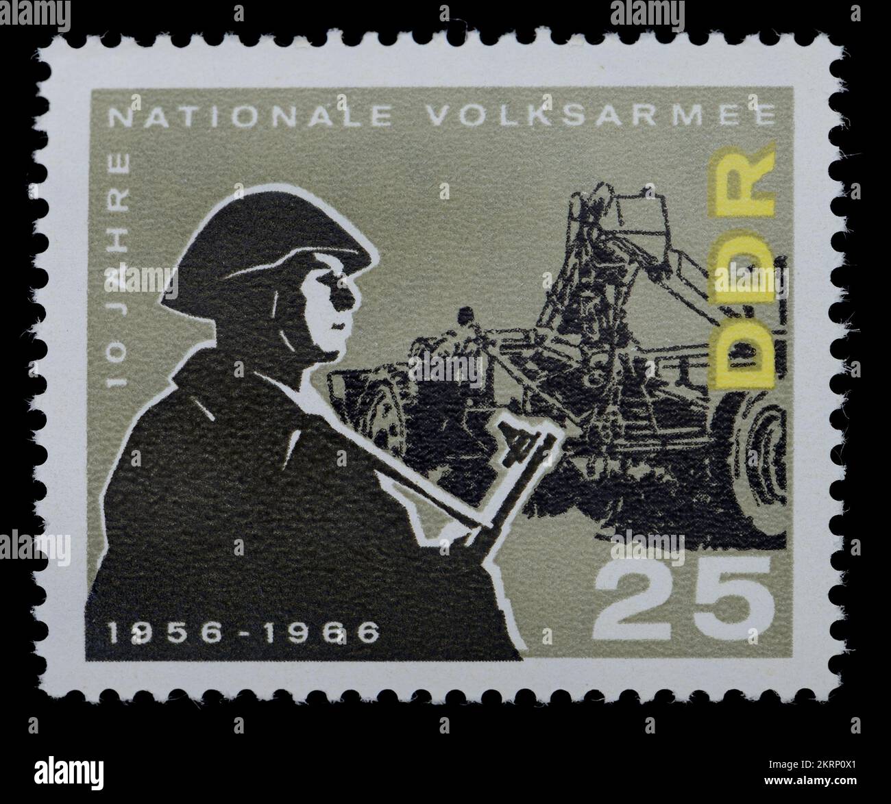 East German (DDR)  postage stamp (1966) : 10th Anniversary of the National People's Army (NVA) - Soldier and potato harvester Stock Photo