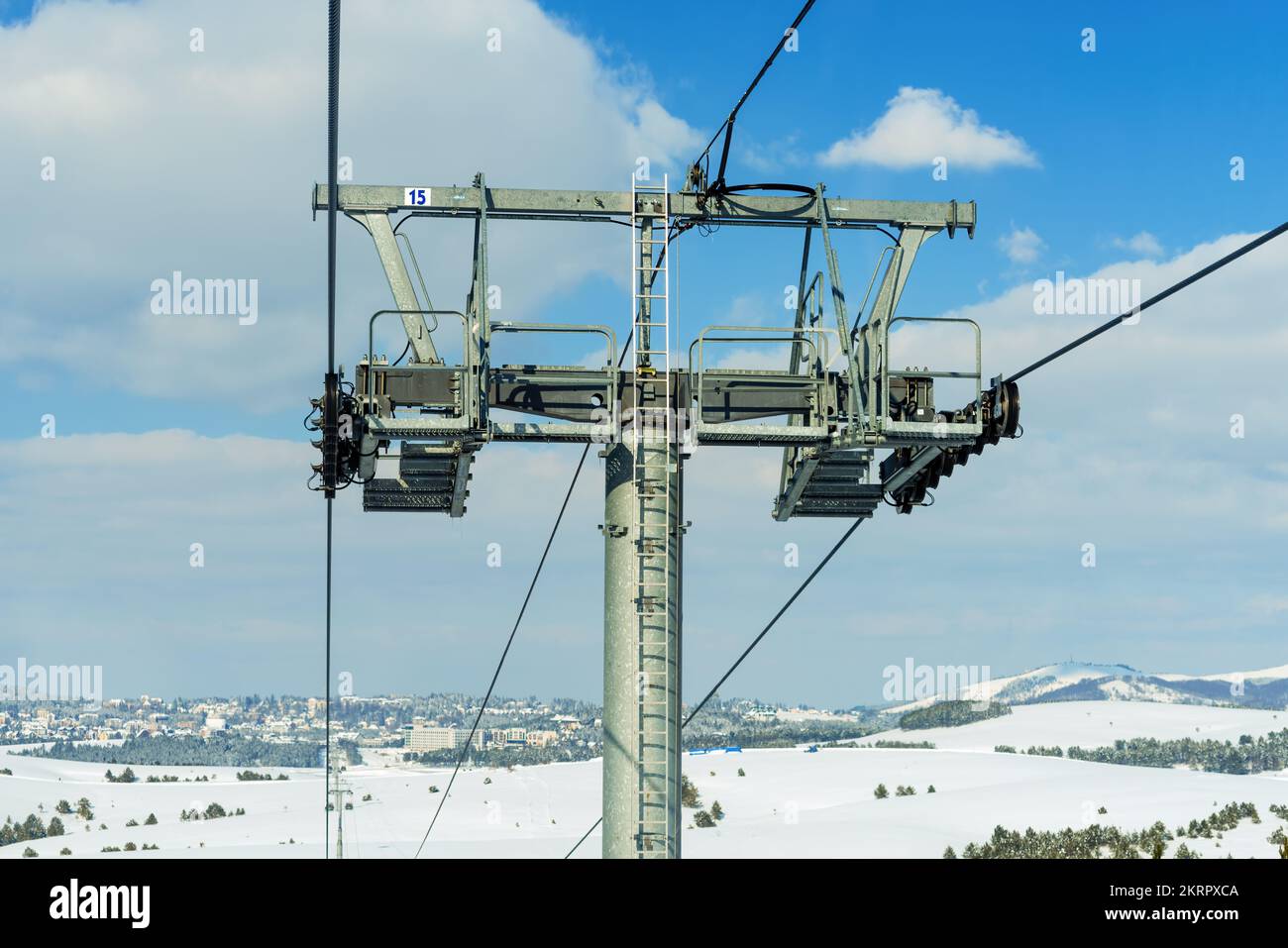 Overhead cable car gondola pylon in winter at Zlatibor mountain on sunny day Stock Photo