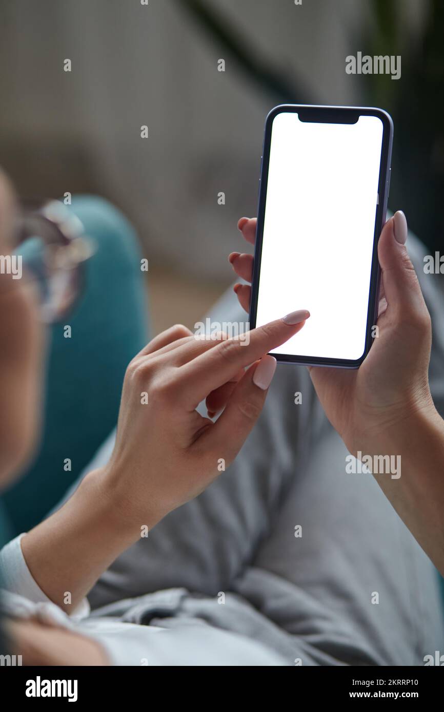 Woman hand holding using touch mobile phone white screen mockup Back ...