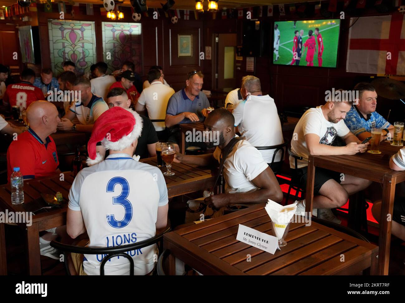 Fans gather at the Red Lion Pub & Restaurant in Doha, Qatar, on the day of the FIFA World Cup Group B match between Wales and England. Picture date: Tuesday November 29, 2022. Stock Photo