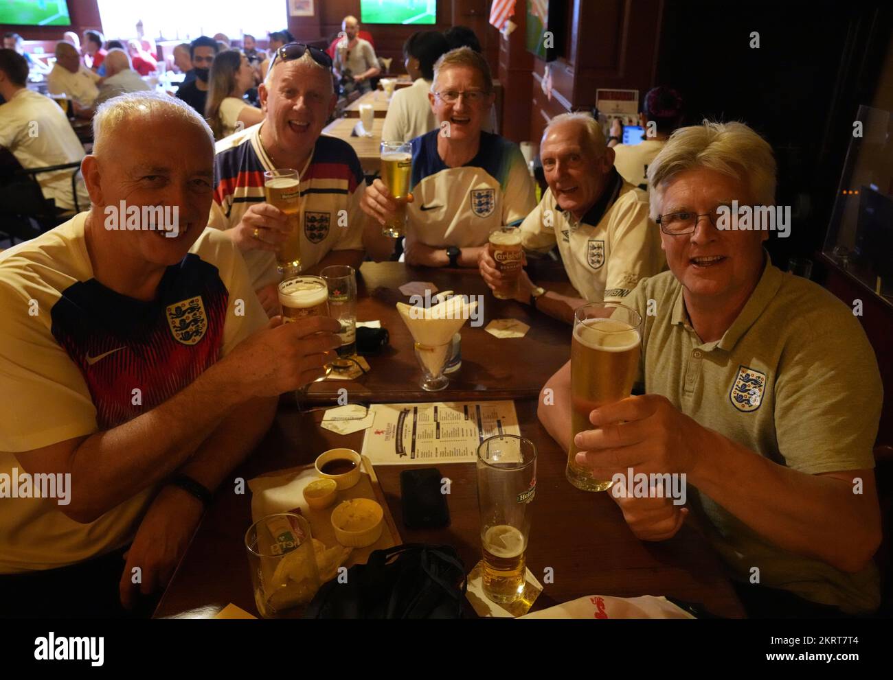 England fans (left to right) Mick Martin, Alan Lyness, Andrew Doyke, David Powell and Alistair Banham in the Red Lion Pub & Restaurant in Doha, Qatar, on the day of the FIFA World Cup Group B match between Wales and England. Picture date: Tuesday November 29, 2022. Stock Photo