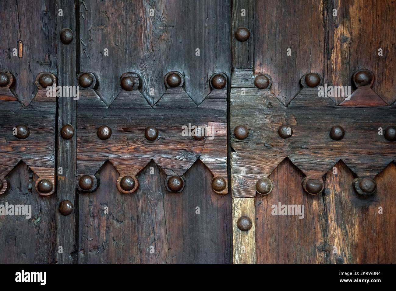Detail of the wooden door of the Shrine Of the Beato Sante near Monbaroccio, a little fortified village in the Province of Pesaro e Urbino in the Ital Stock Photo