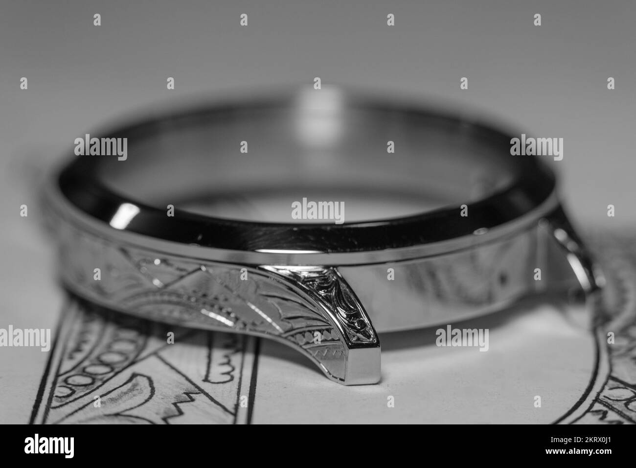 Closeup, silver blank for production of pocket watches, sketch and