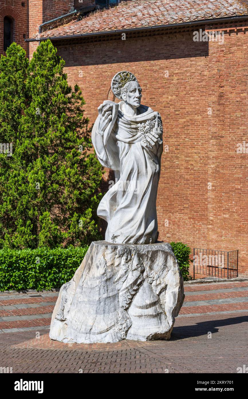 White marble statue of Saint Benedict in front of Benedictine Abbey of Monte Oliveto Maggiore, Province of Siena, Tuscany, Italy Stock Photo