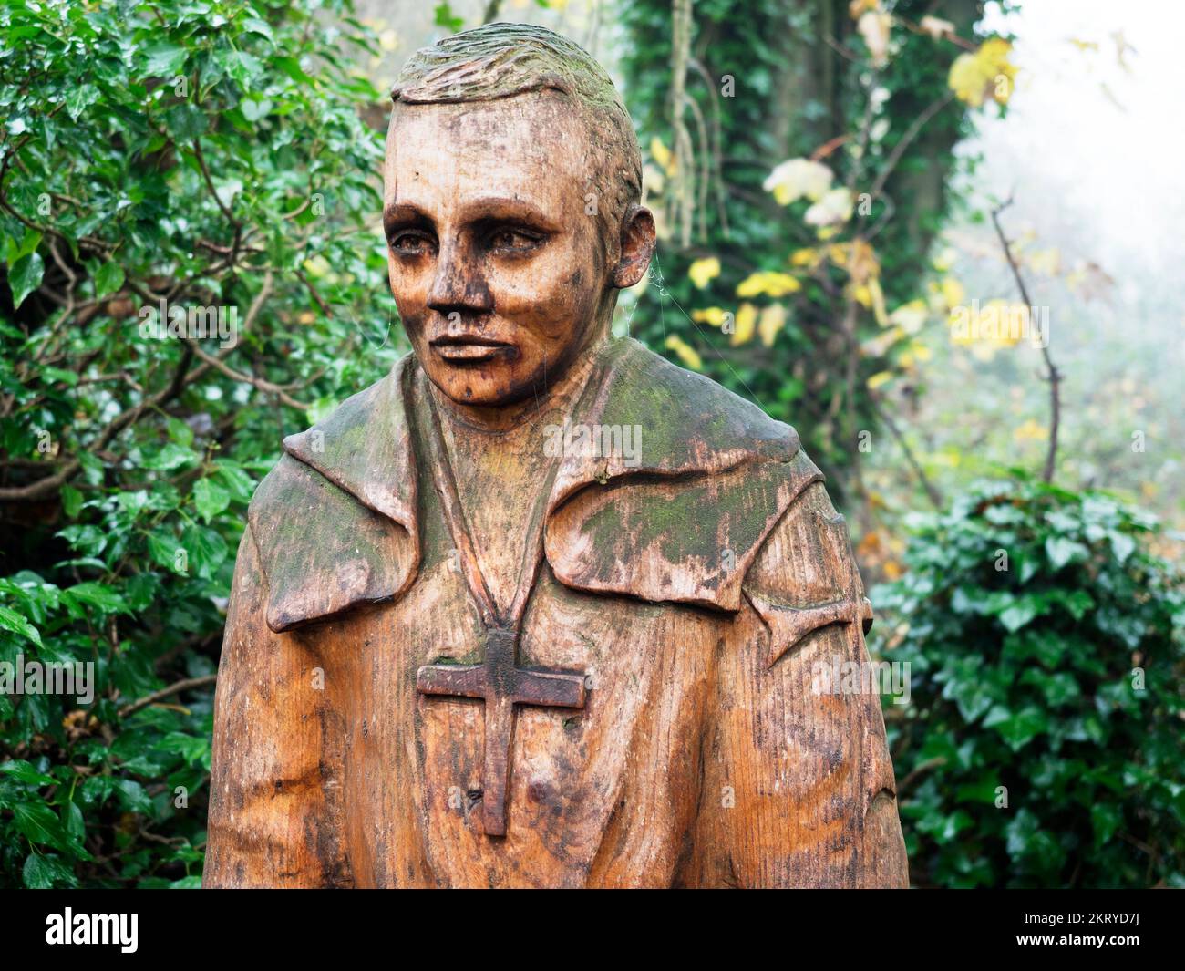 Wooden statue of St Robert at St Roberts Cave on Abbey Road in Knaresborough North Yorkshire England Stock Photo