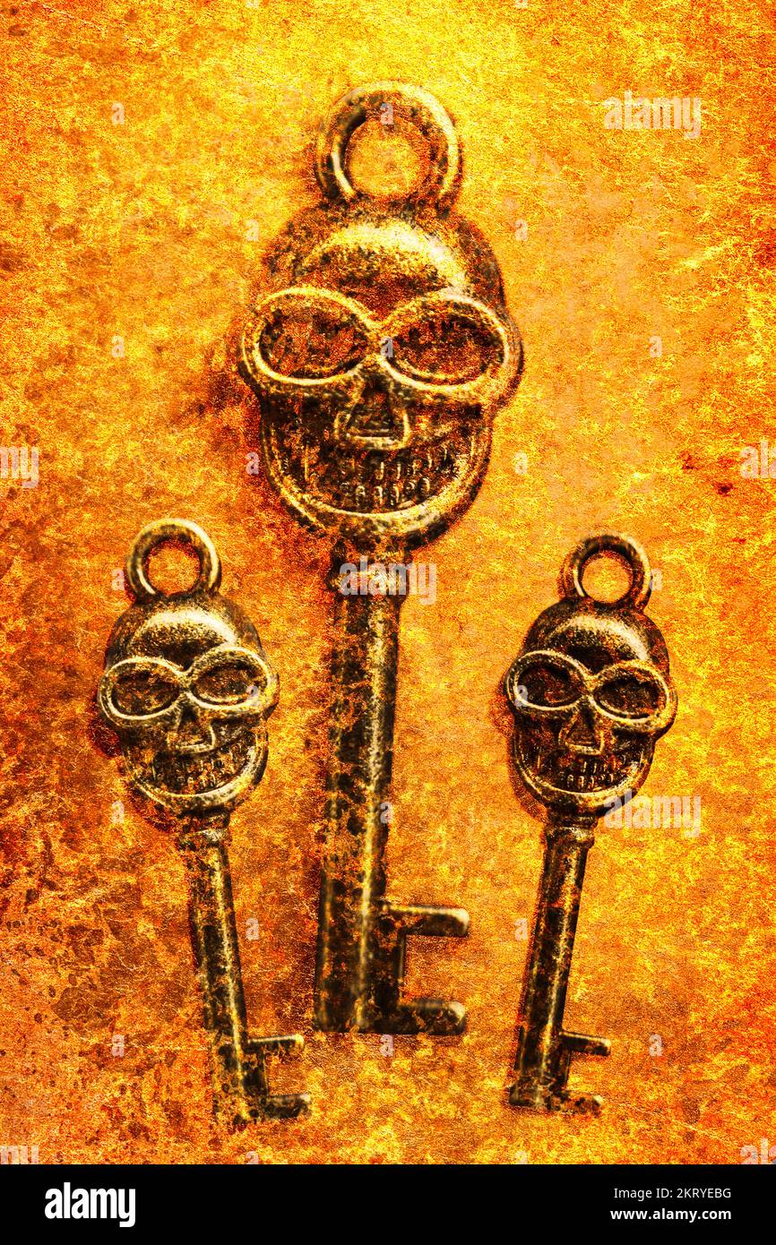 Closeup of scary metal skull shaped keys of different size in flame