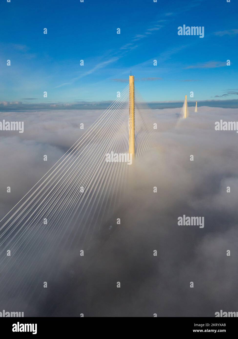 South Queensferry, Scotland, UK. 29th November 2022. The towers of Queensferry Crossing Bridge are visible above ground level fog on the Firth of Forth caused by cloud inversion today at South Queensferry. The 1.7 miles (2.7km) bridge is the longest 3-tower, cable-stayed bridge in the world.  Iain Masterton/Alamy Live News Stock Photo