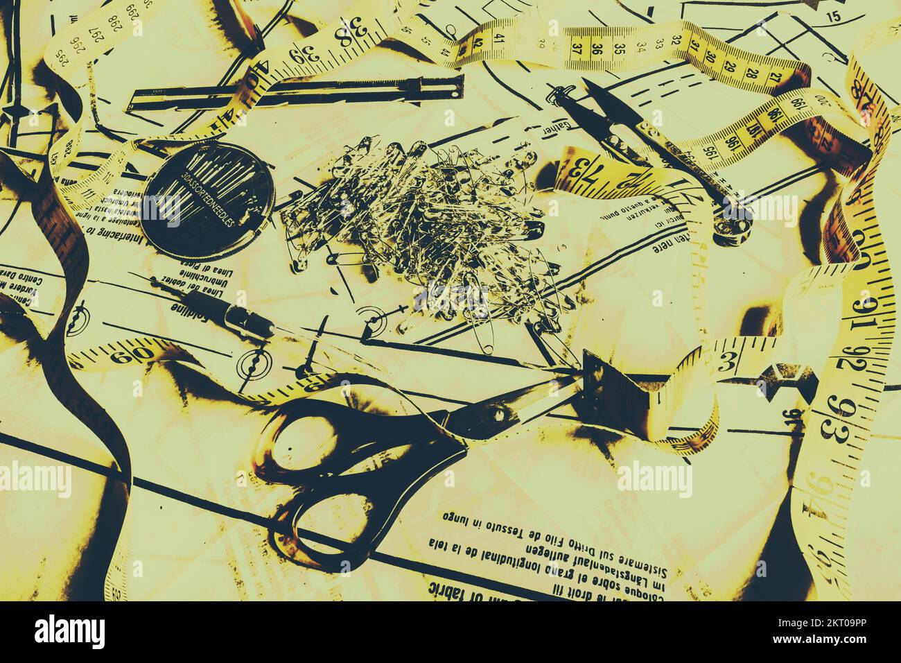 Old creative stilllife art on a dressmakers desk with various tools of the seamstress trade