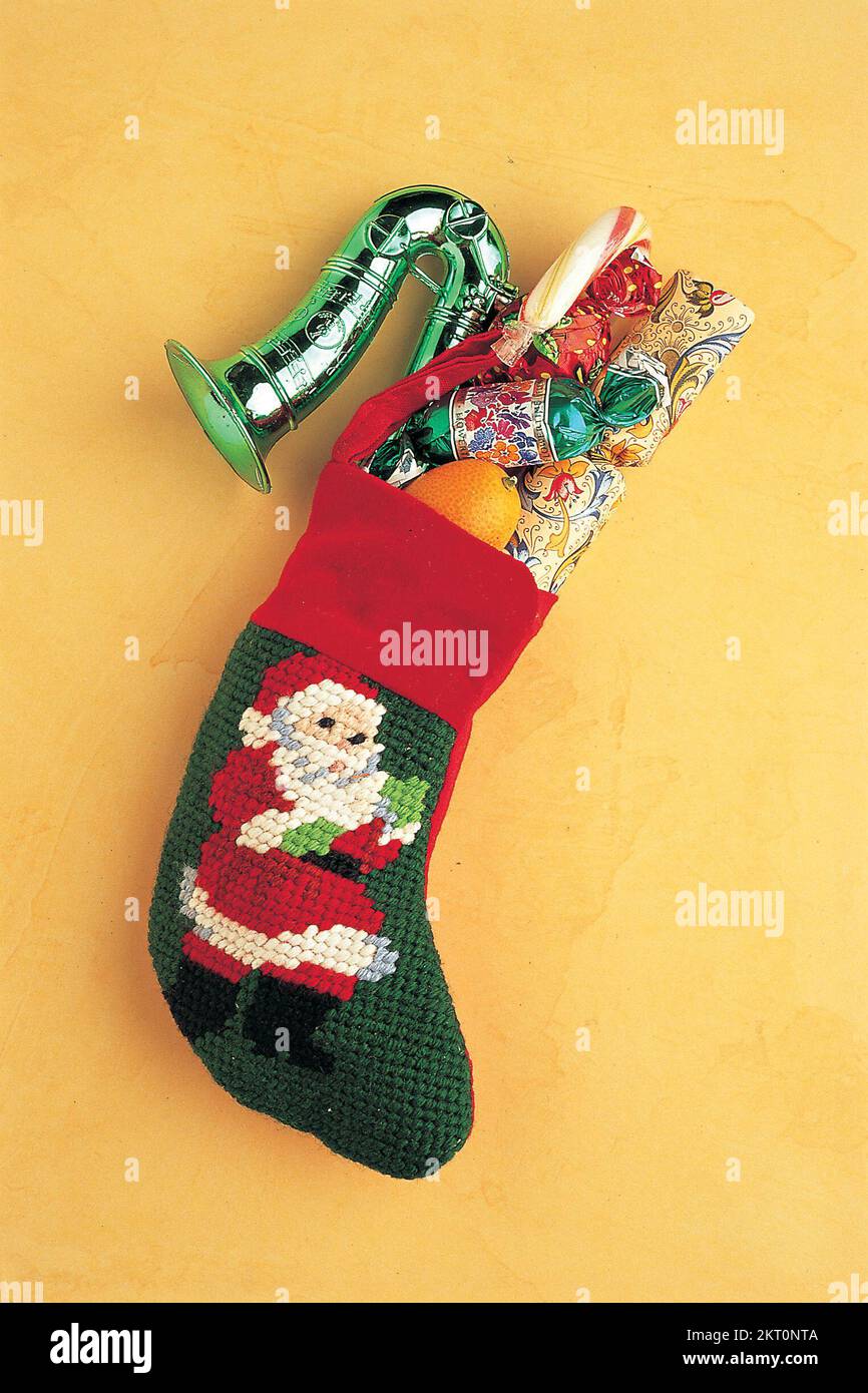 Christmas stocking filled presents hi-res stock photography and images ...