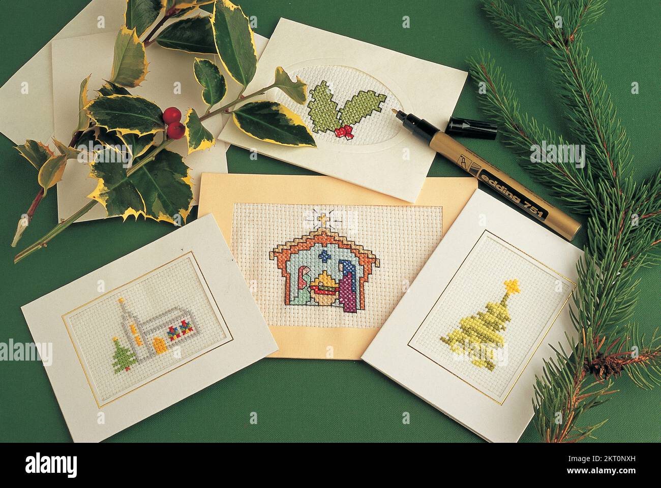 Christmas cards embroidered with seasonal motifs Stock Photo
