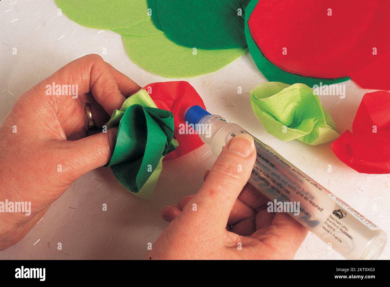 Gluing the petals of the paper flower Stock Photo Alamy