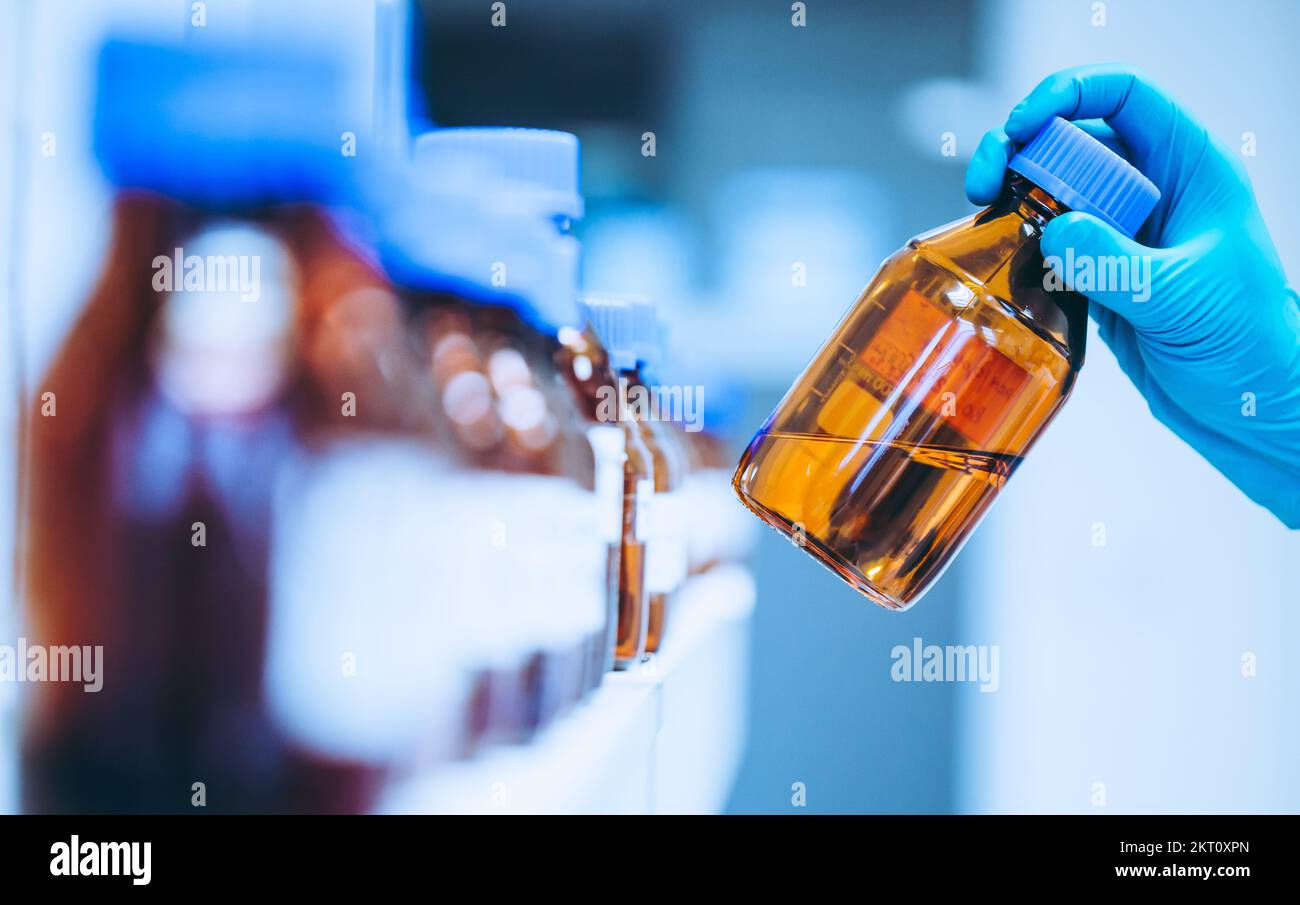 Pharmacist making medicines in the laboratory, pharmacy production