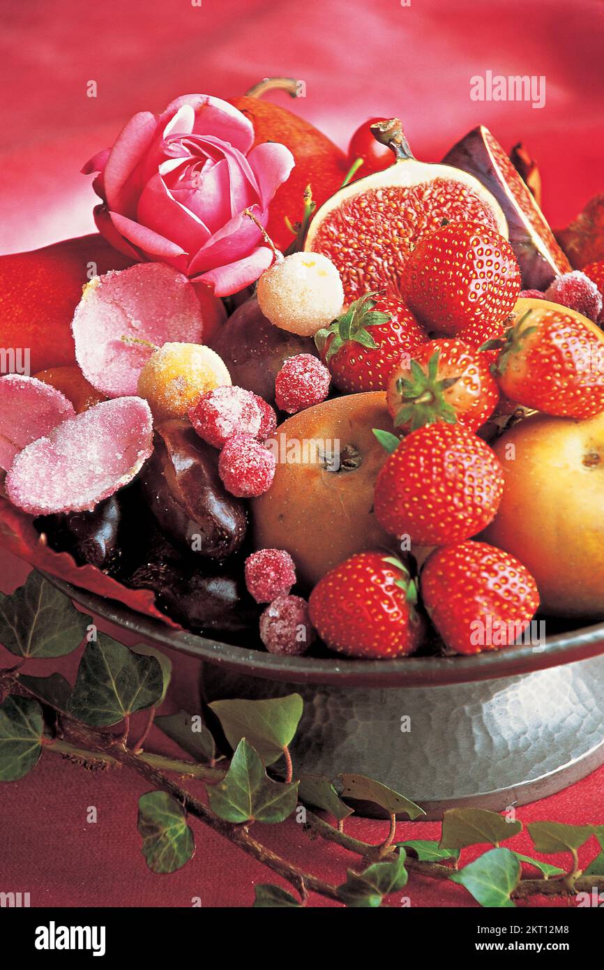 Pewter dish filled with sugared fruits Stock Photo