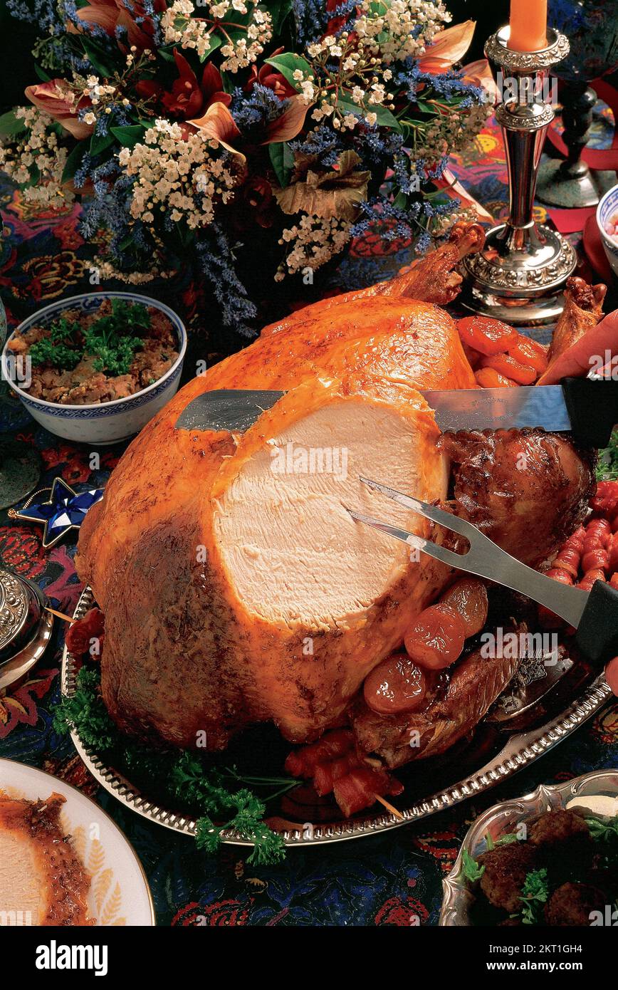 Carving the Roast Turkey with a knife Stock Photo Alamy