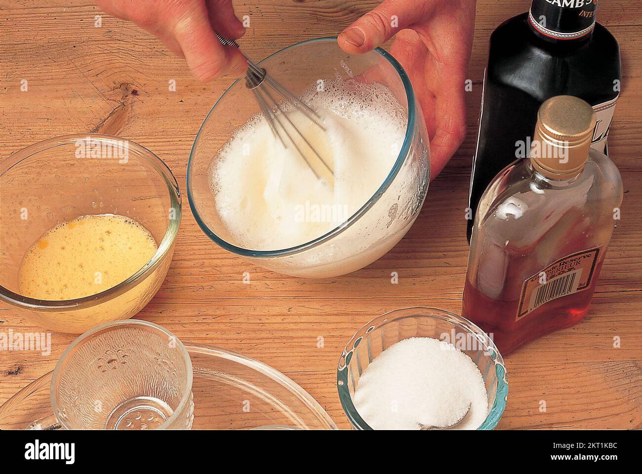 Beating the egg yolks and sugar Stock Photo Alamy