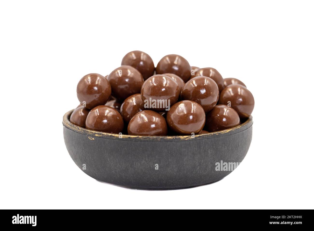Chocolate coated hazelnut dragee. Chocolates with hazelnut dragee