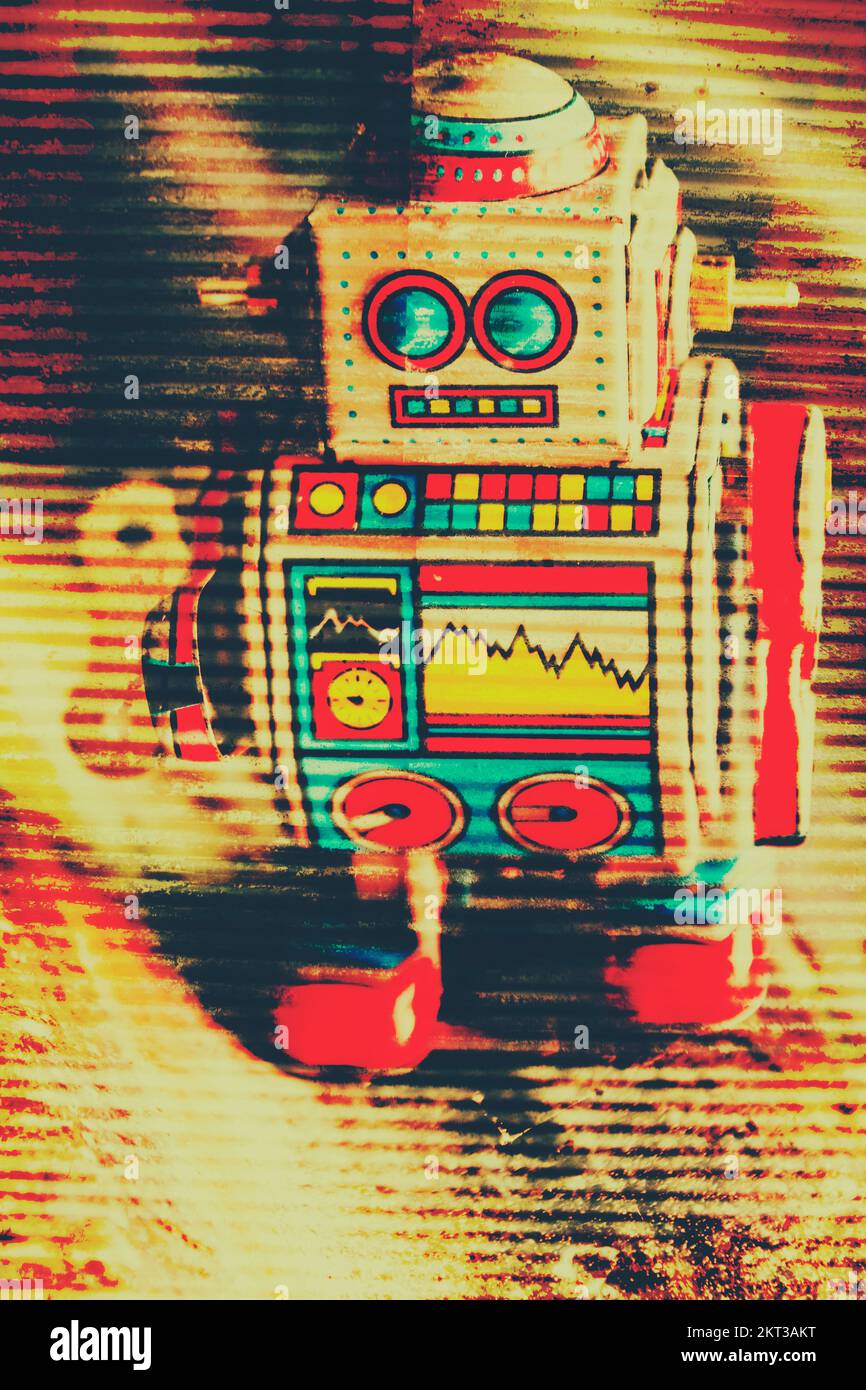 Artistic vintage art on a yellow tone metal toy robot on rusty tin sign. Lines of circuitry Stock Photo