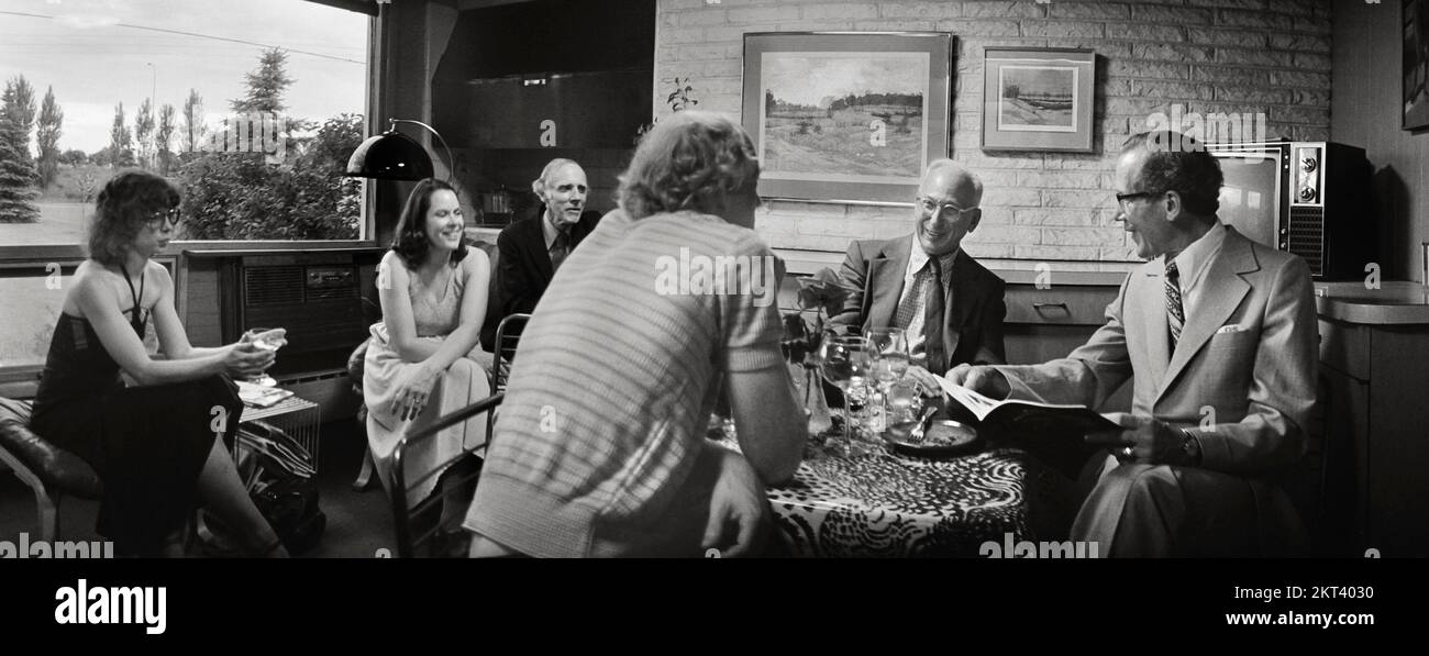 Photographer, art patron, businessman Fred Scheel (right) visiting with photographer André Kertész (second from the right) in Fargo, North Dakota. Stock Photo
