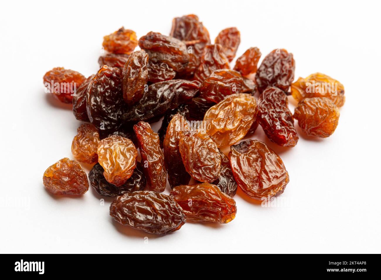 dried sultanas on a white background Stock Photo - Alamy