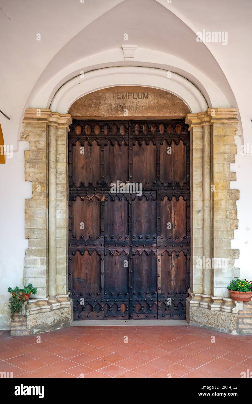 Wooden door of the Shrine Of the Beato Sante near Monbaroccio, a little fortified village in the Province of Pesaro e Urbino in the Italian region Mar Stock Photo