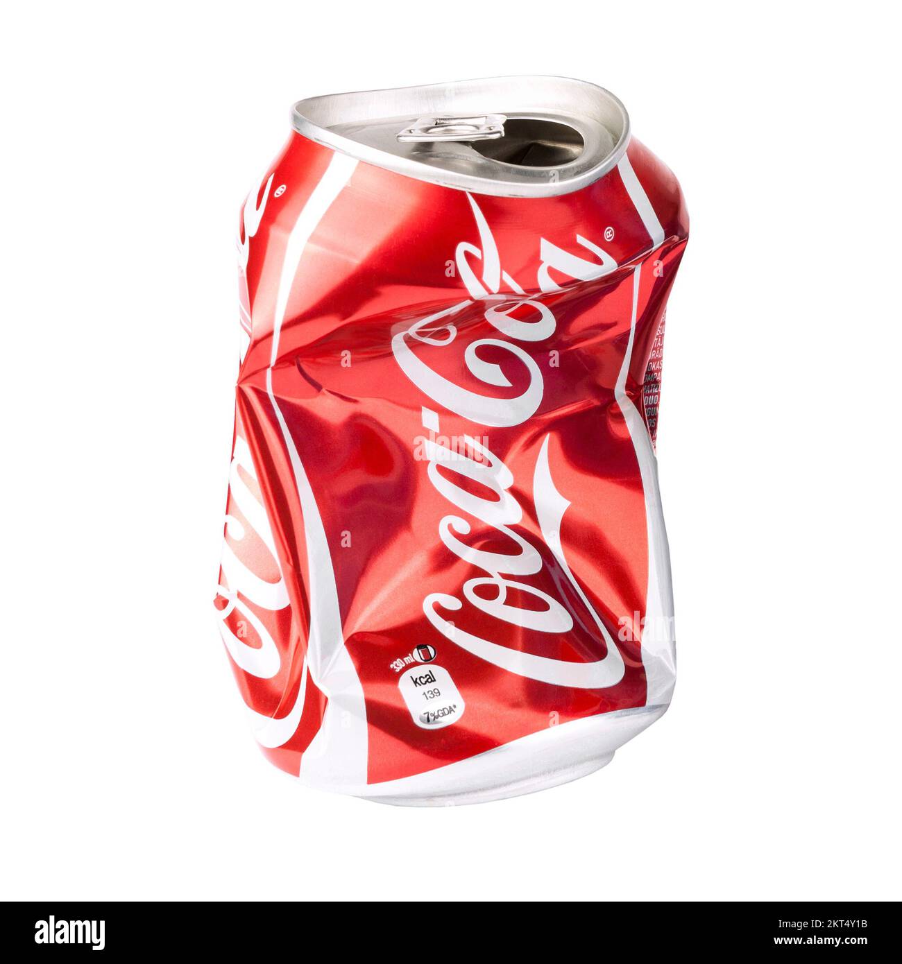 Crushed Coca Cola 330 ml can, isolated on white background, front view close up studio shot Stock Photo