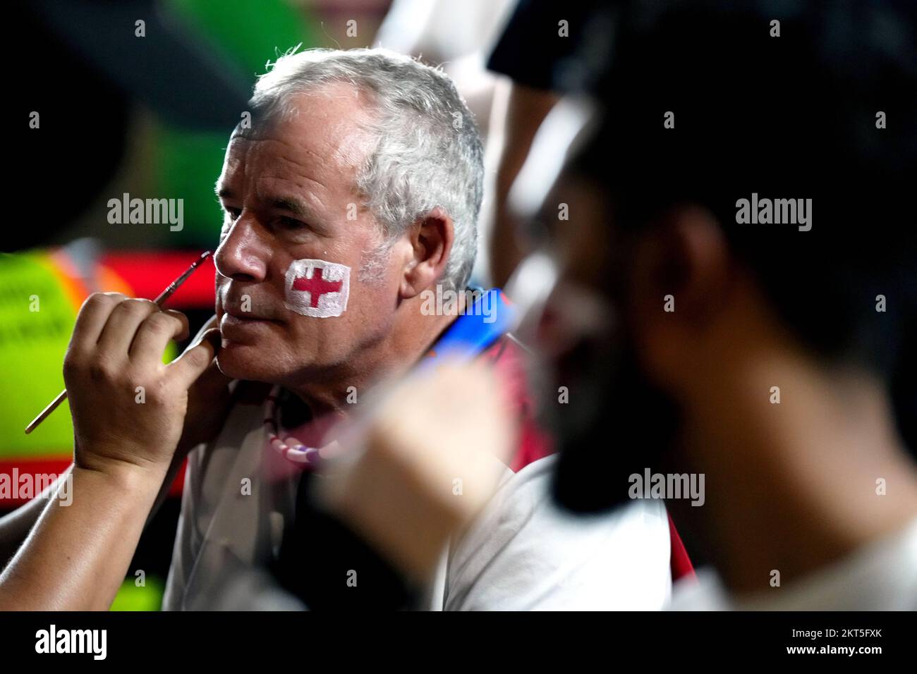 An England fan has a St George's cross painted on his cheeks ahead of the FIFA World Cup Group B match at the Ahmad Bin Ali Stadium, Al Rayyan, Qatar. Picture date: Tuesday November 29, 2022. Stock Photo