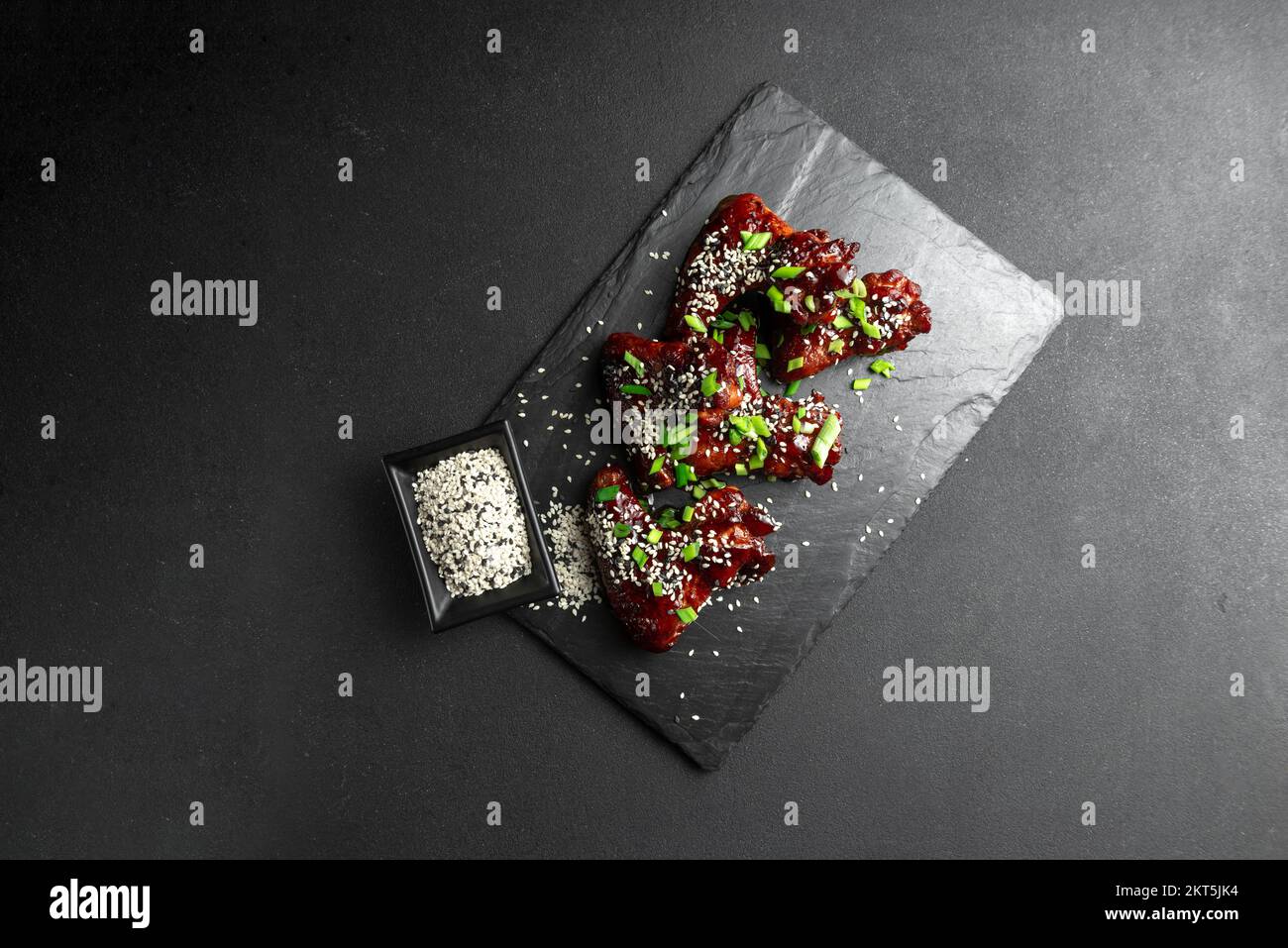 Asian Food. Homemade Koreanstyle spicy chicken wings with sesame seeds. Chicken wings