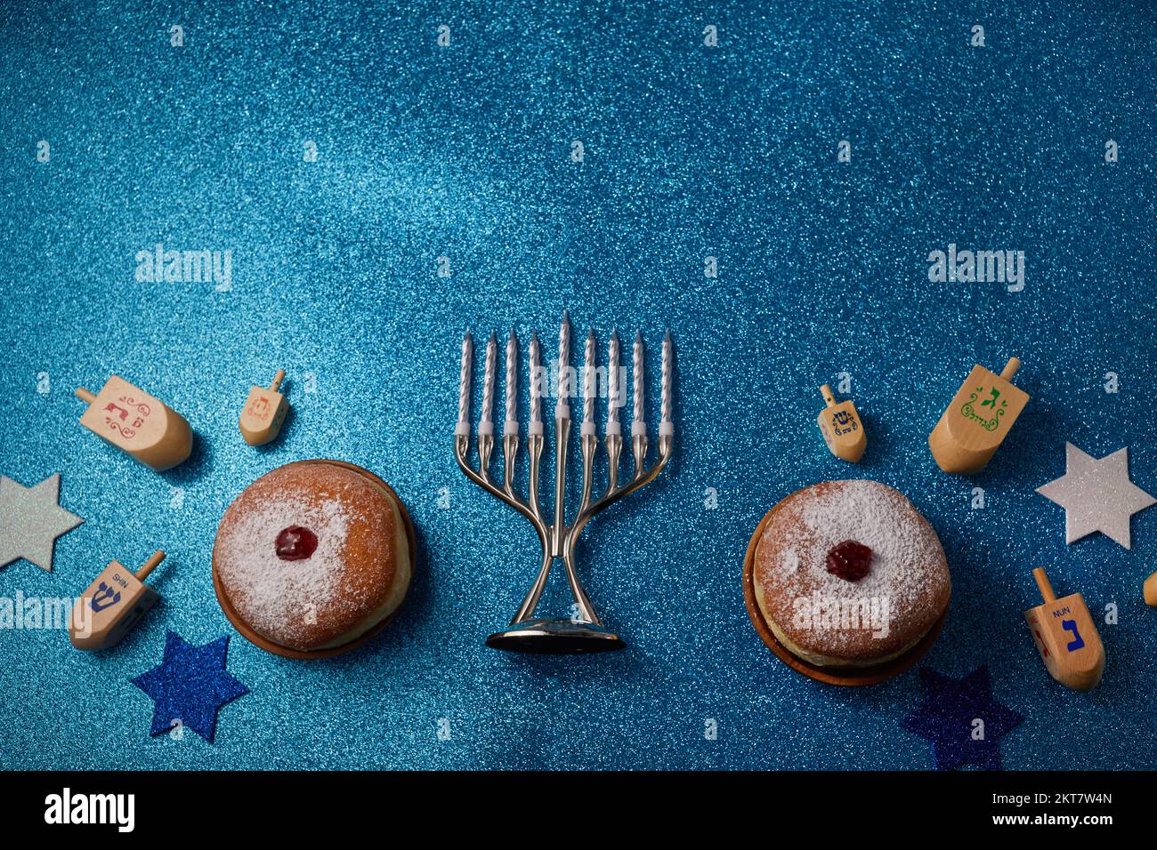 Jewish holiday Hanukkah background with menorah and dreidel with