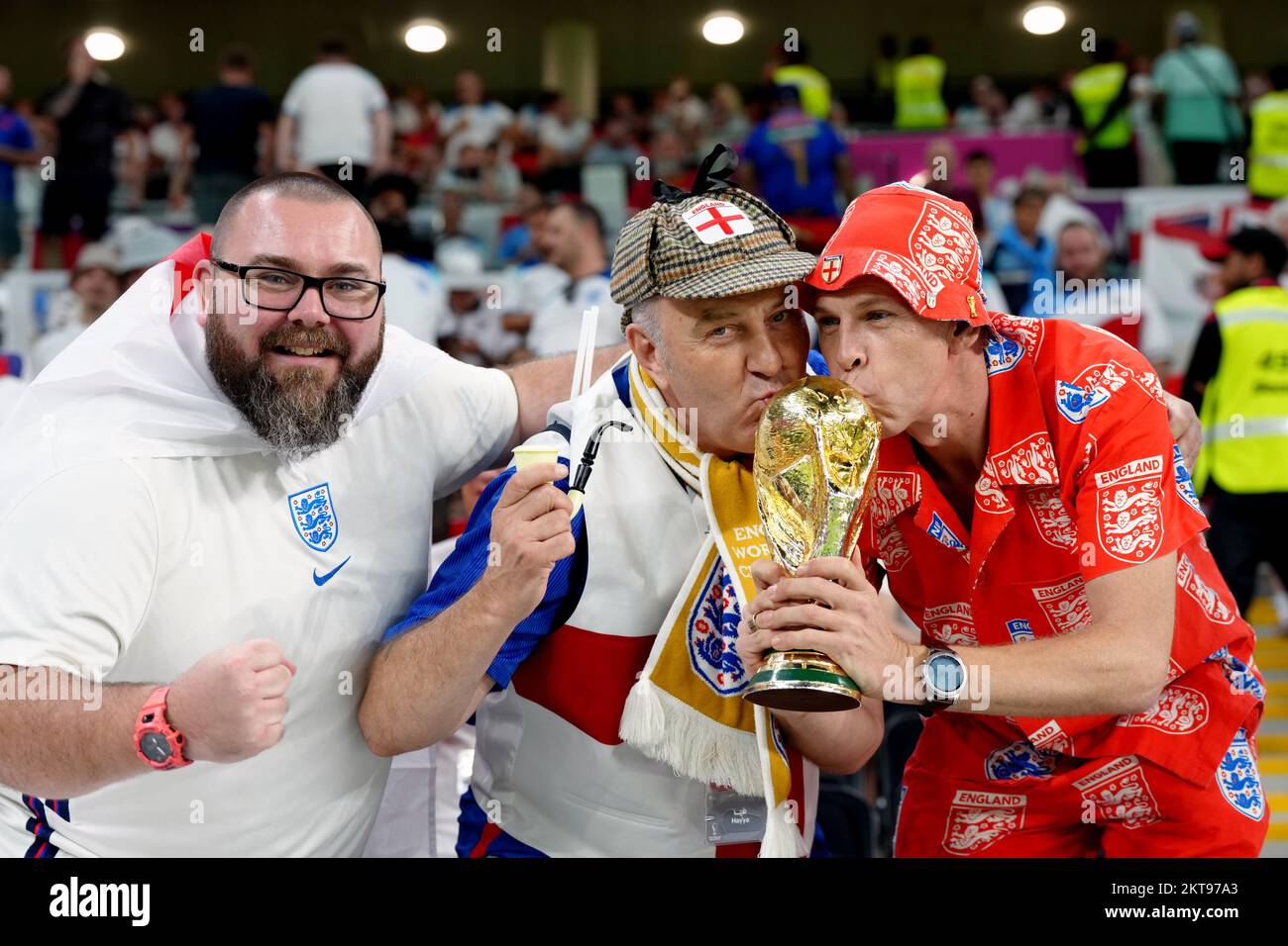 England fans with a replica World Cup trophy ahead of the FIFA World Cup Group B match at the Ahmad Bin Ali Stadium, Al Rayyan, Qatar. Picture date: Tuesday November 29, 2022. Stock Photo