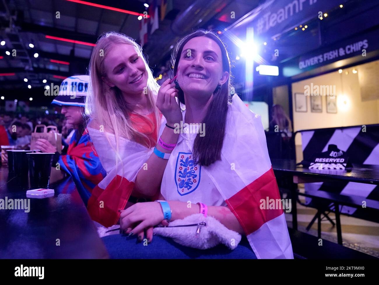 England fans use face paint at BoxPark Wembley, during a screening of the FIFA World Cup Group B match between Wales and England. Picture date: Tuesday November 29, 2022. Stock Photo