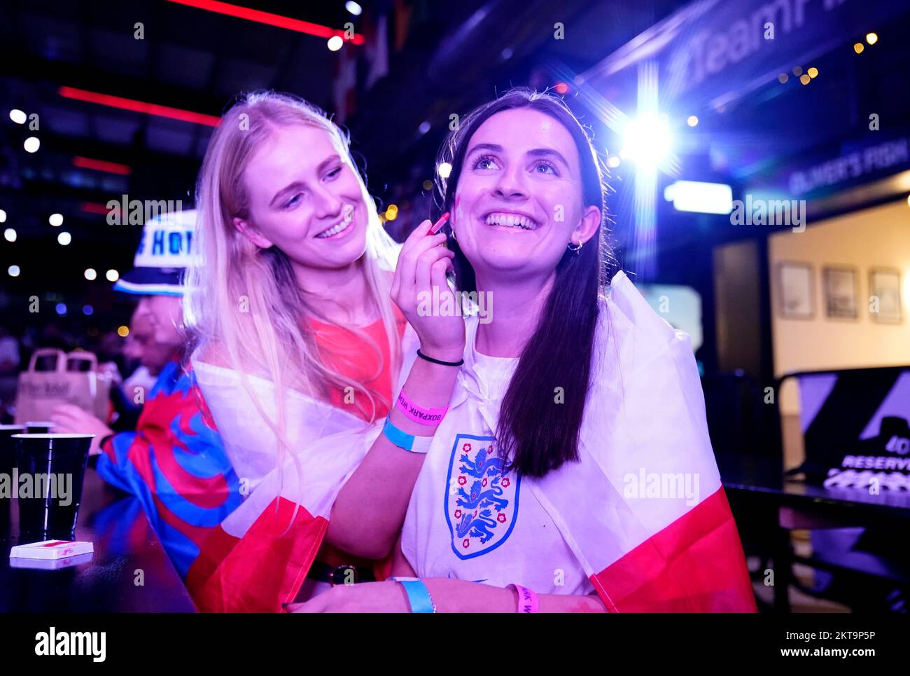 England fans use face paint at BoxPark Wembley, during a screening of the FIFA World Cup Group B match between Wales and England. Picture date: Tuesday November 29, 2022. Stock Photo