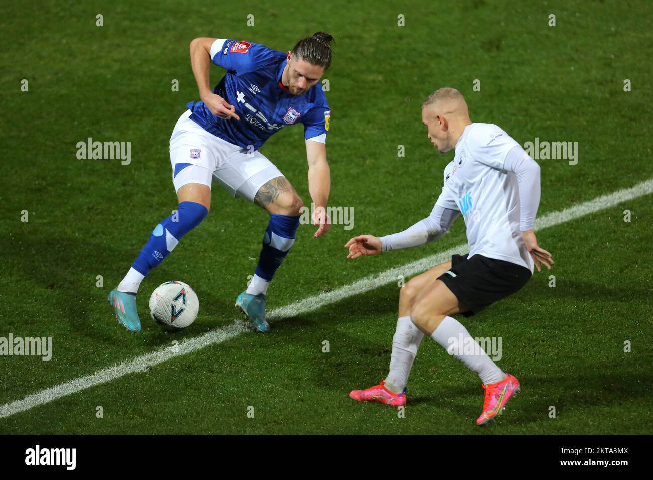 Wes Burns of Ipswich Town and Lindon Meikle of Buxton - Ipswich Town v Buxton, The Emirates FA Cup second round, Portman Road, Ipswich, UK - 27th November 2022  Editorial Use Only - DataCo restrictions apply Stock Photo