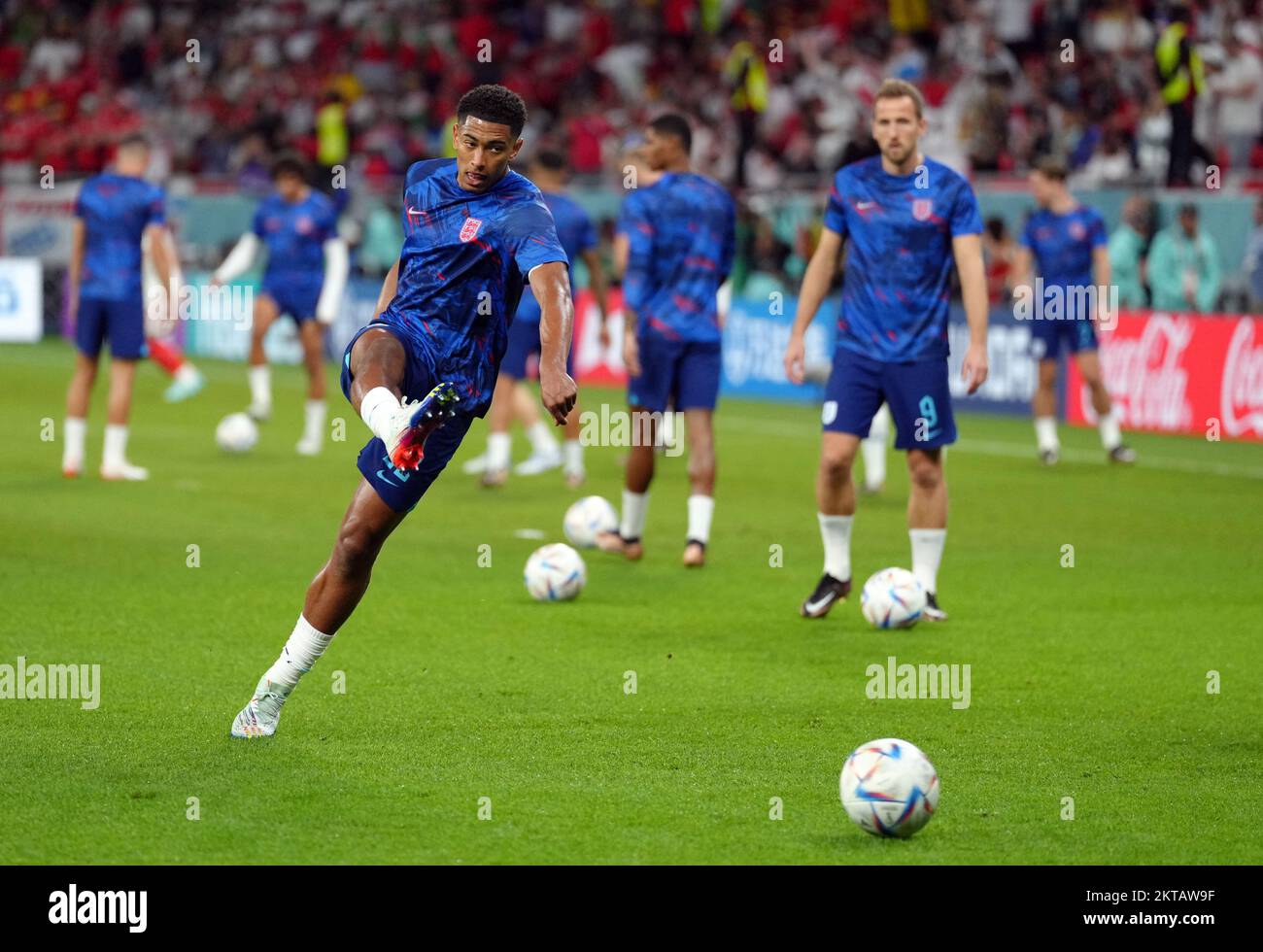 England's Jude Bellingham warms up ahead of the FIFA World Cup Group B match at the Ahmad Bin Ali Stadium, Al Rayyan, Qatar. Picture date: Tuesday November 29, 2022. Stock Photo