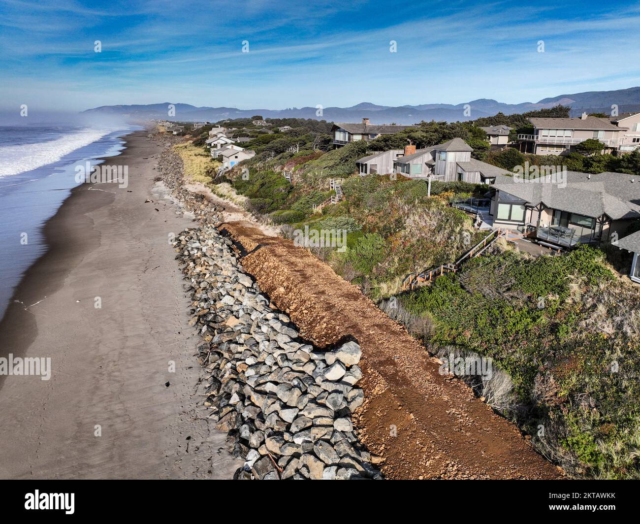 Communities along the Pacific Coast of the U.S. are attempting to combat sea level rise  by installing engineered riprap rock shoreline structures. Stock Photo