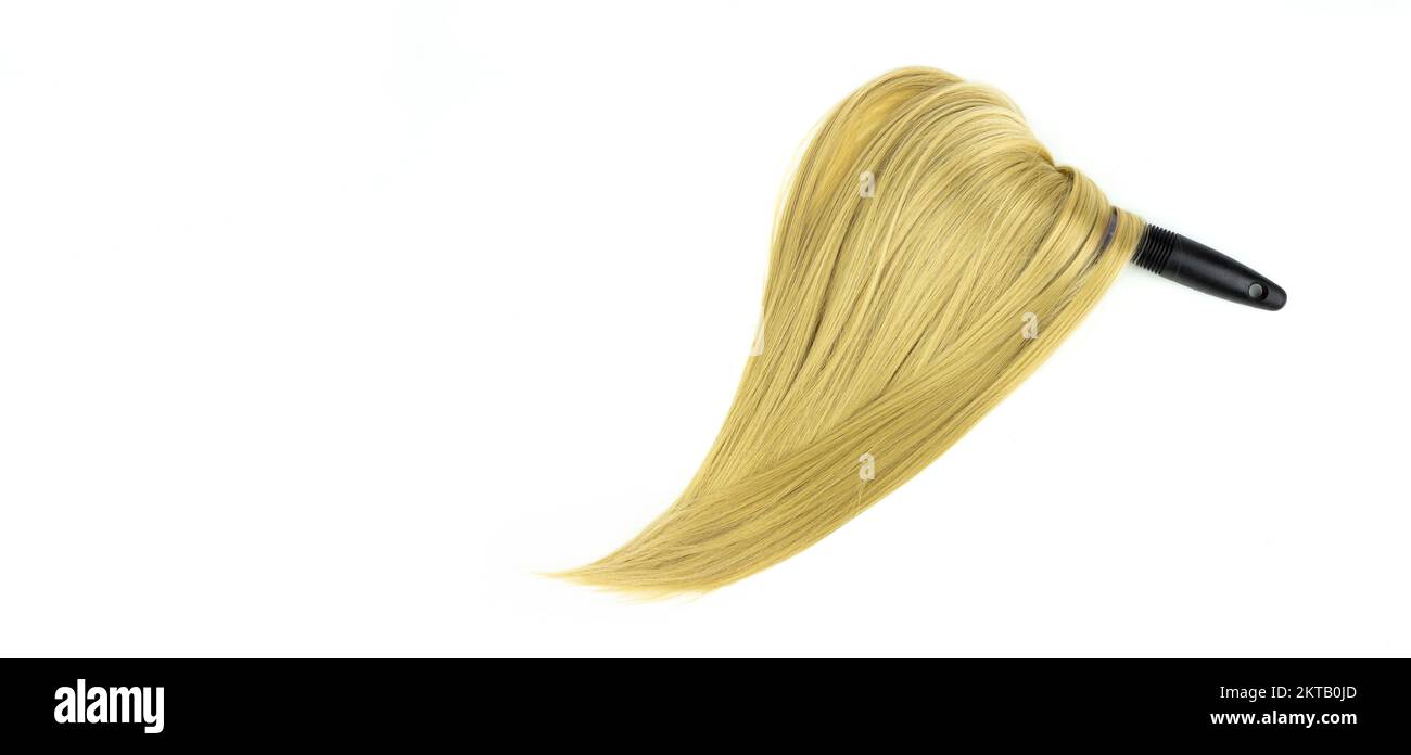 Shine long blond hair with round brush. Spa treatment. Top view flat lay of round hair comb and Blond natural hair on it Stock Photo