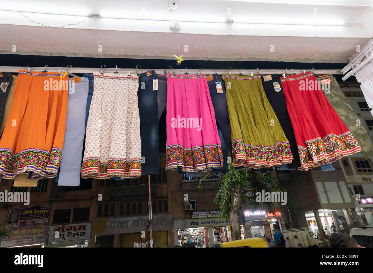 Jodhpur, Rajasthan, India - 19.10.2019 : Rajasthani womens clothes are hanging for sale , being displayed in a shop at famous Sardar Market and Ghanta Stock Photo