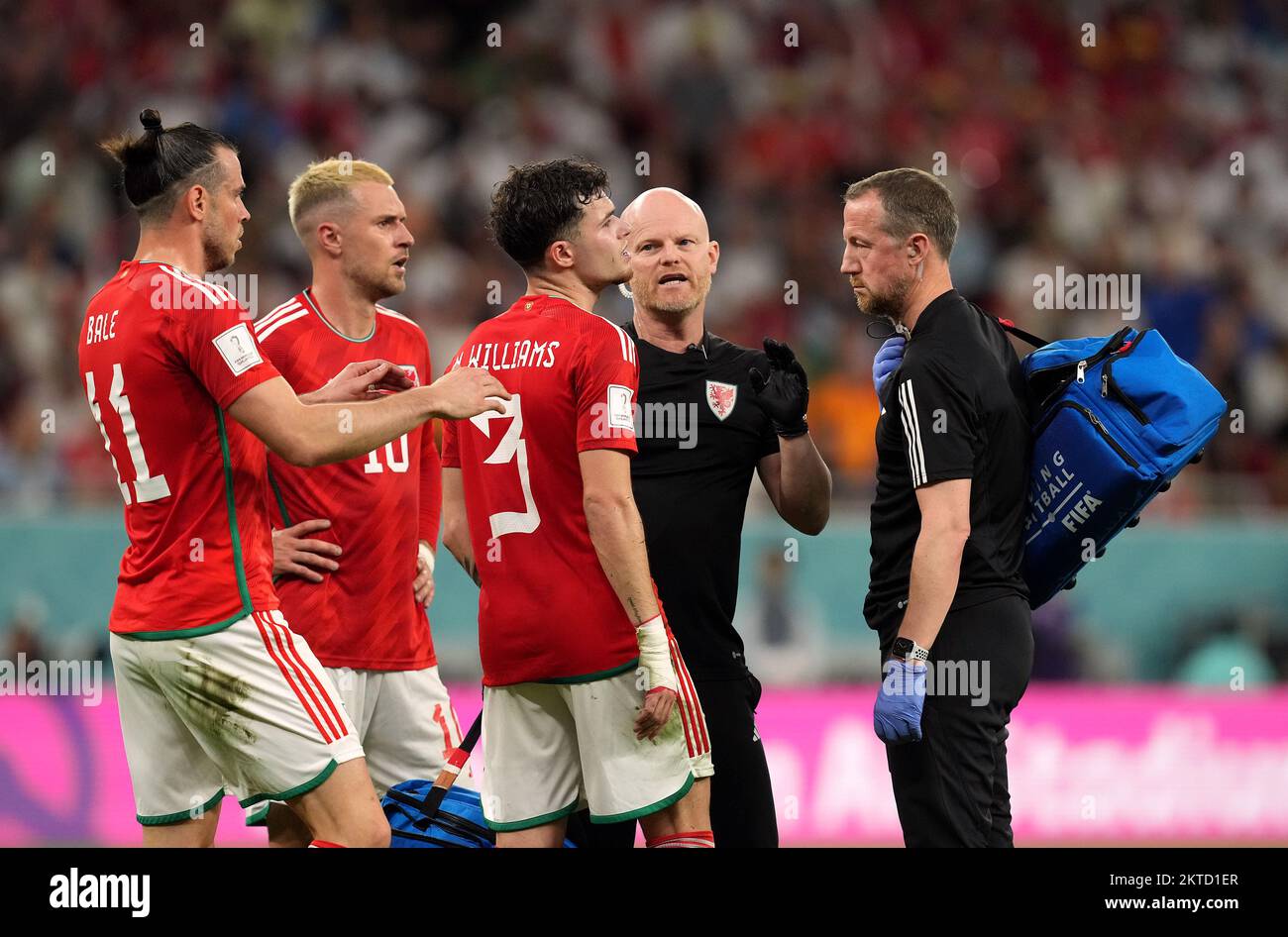 Wales’ Neco Williams leaves the pitch as a suspected concussion substitution during the FIFA World Cup Group B match at the Ahmad Bin Ali Stadium, Al Rayyan, Qatar. Picture date: Tuesday November 29, 2022. Stock Photo