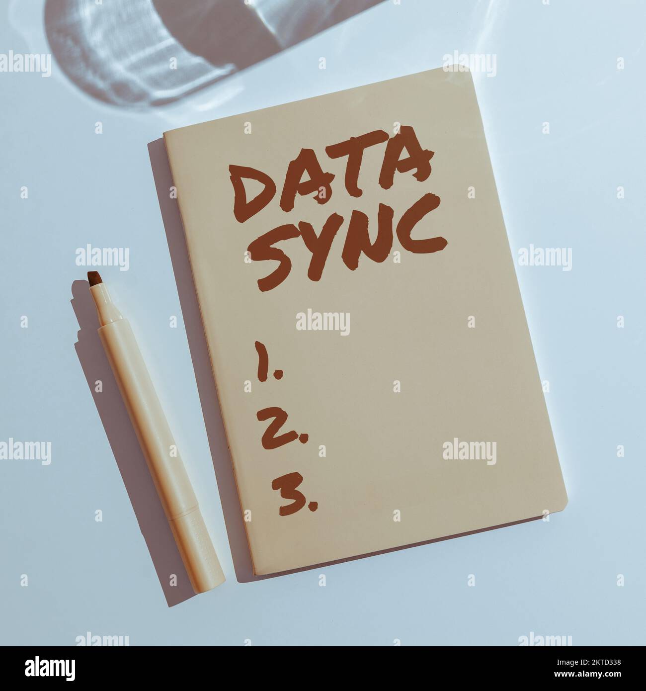 Writing displaying text Data Sync, Internet Concept data that is continuously generated by different sources Stock Photo