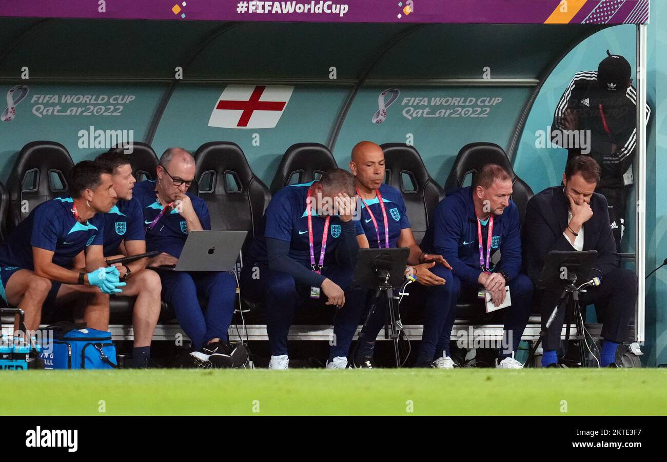 England manager Gareth Southgate watches a reply with his back room staff during the FIFA World Cup Group B match at the Ahmad Bin Ali Stadium, Al Rayyan, Qatar. Picture date: Tuesday November 29, 2022. Stock Photo
