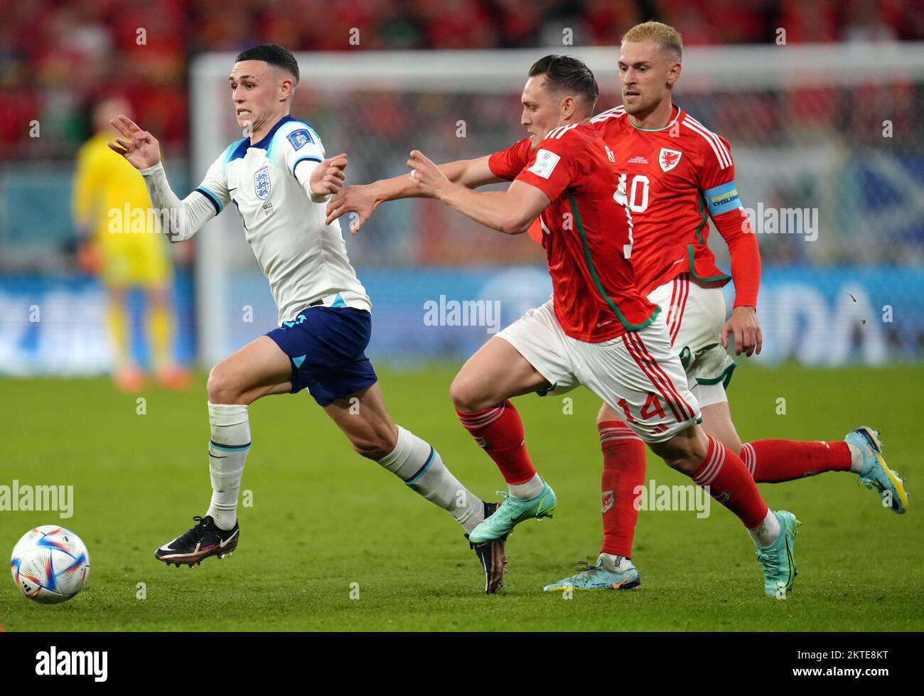 England's Phil Foden gets past Wales' Connor Roberts during the FIFA World Cup Group B match at the Ahmad Bin Ali Stadium, Al Rayyan, Qatar. Picture date: Tuesday November 29, 2022. Stock Photo