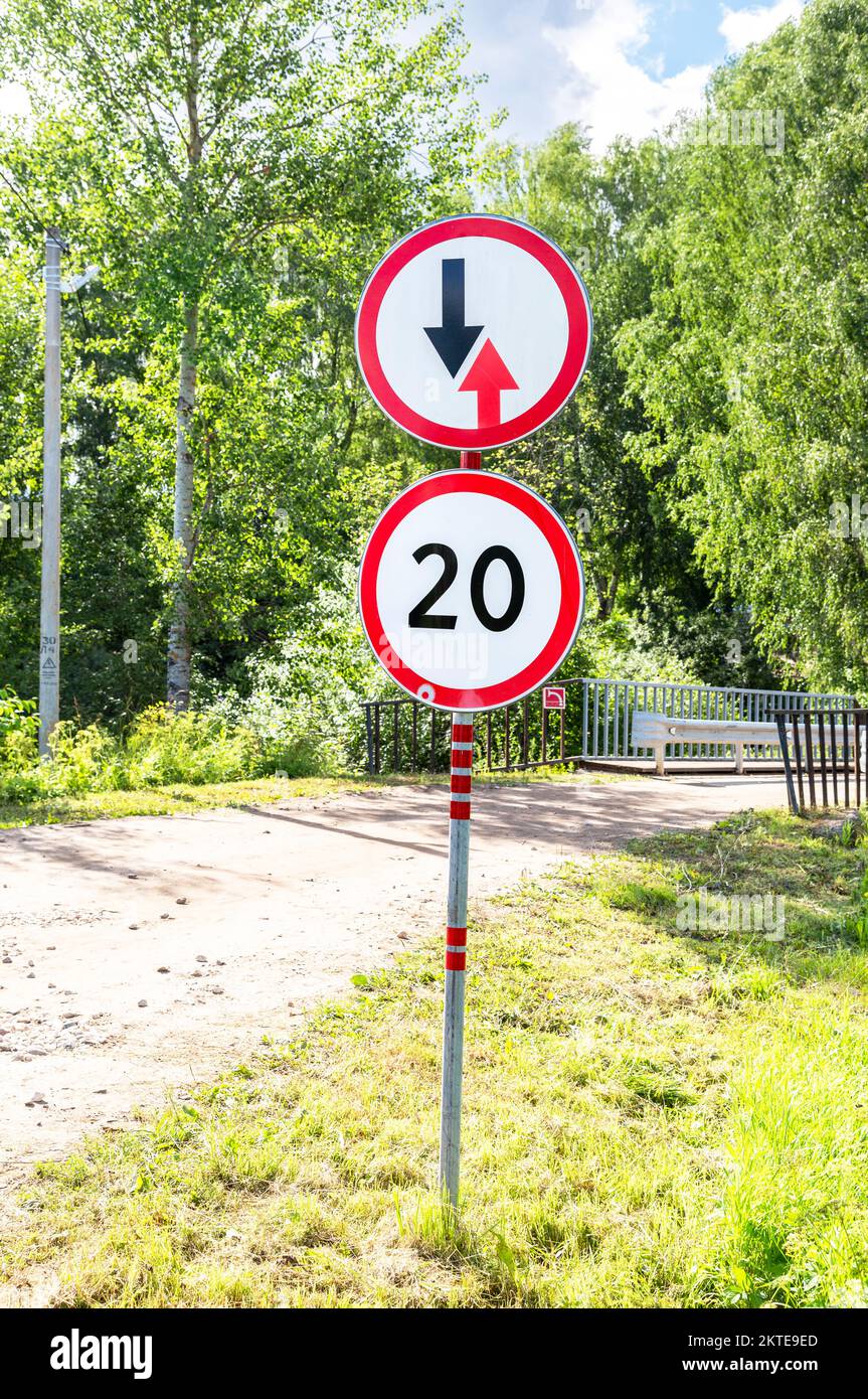 Road signs on a country road on a summer sunny day Stock Photo
