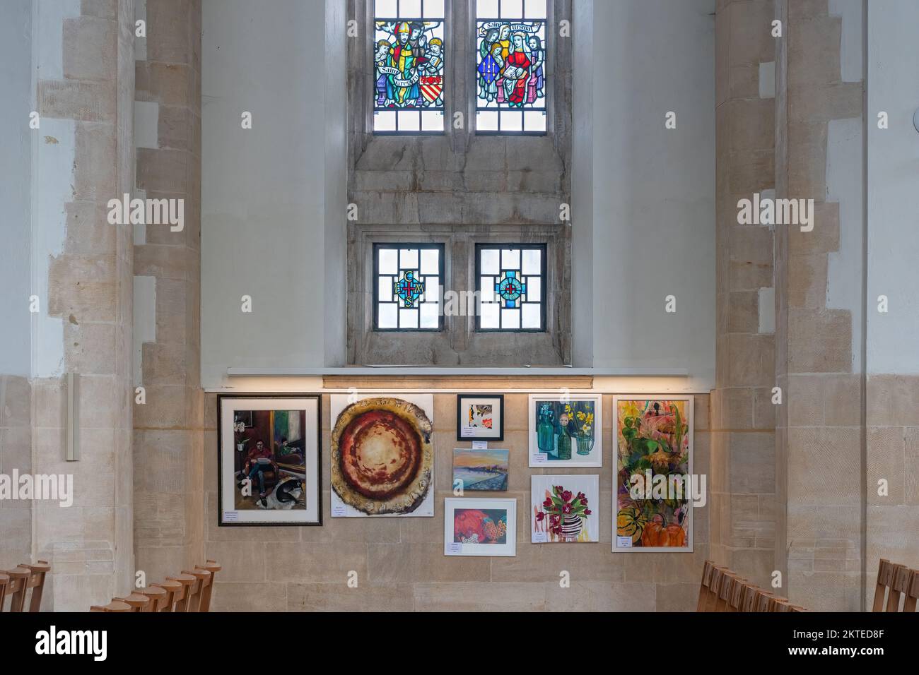 Art exhibition inside Guildford Cathedral with stained glass windows