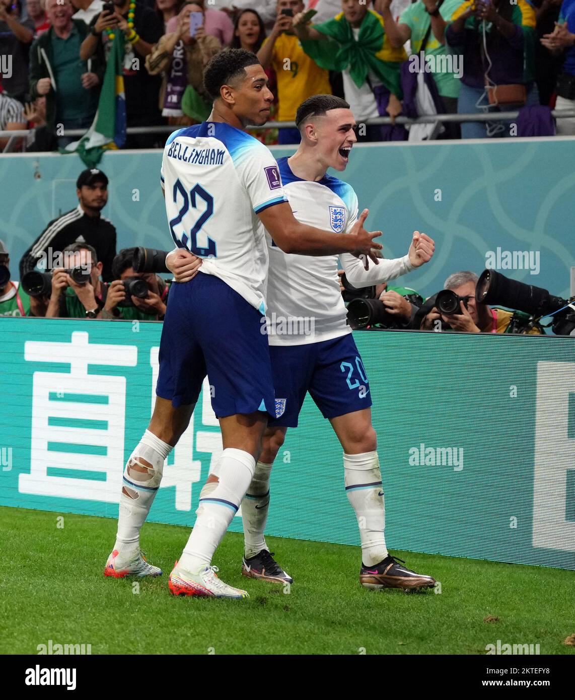 England's Phil Foden celebrates scoring the second goal with Jude Bellingham during the FIFA World Cup Group B match at the Ahmad Bin Ali Stadium, Al Rayyan, Qatar. Picture date: Tuesday November 29, 2022. Stock Photo