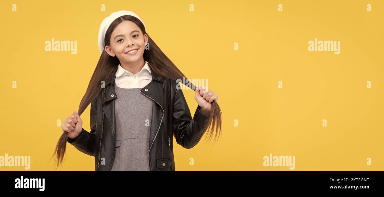 Expert care for every haircare need. School age kid hold long hair. Hair salon. Child face, horizontal poster, teenager girl isolated portrait, banner Stock Photo